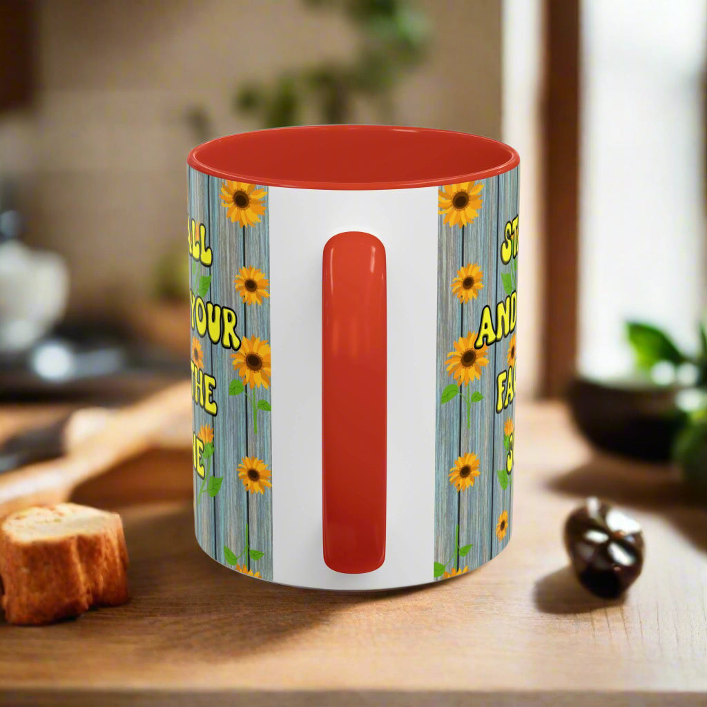ceramic mug with sunflower background quote "Stand tall and keep your face to the sunshine" red interior red handle