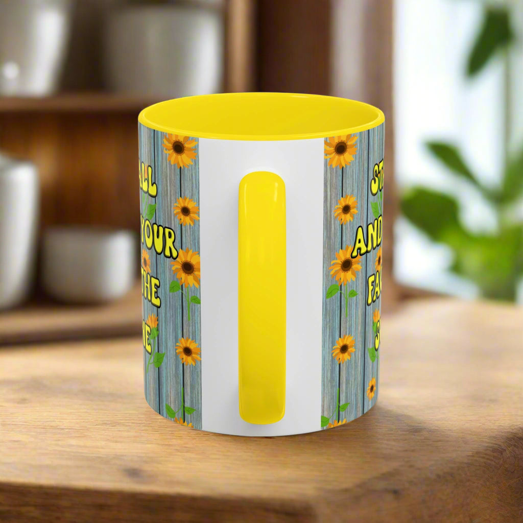 ceramic mug with sunflower background quote "Stand tall and keep your face to the sunshine" yellow interior yellow handle