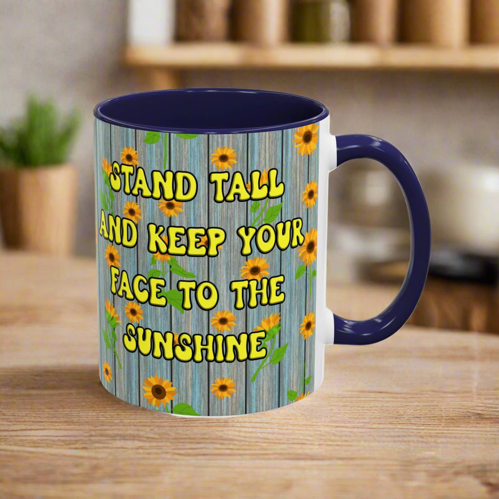 ceramic mug with sunflower background quote "Stand tall and keep your face to the sunshine" black interior black handle