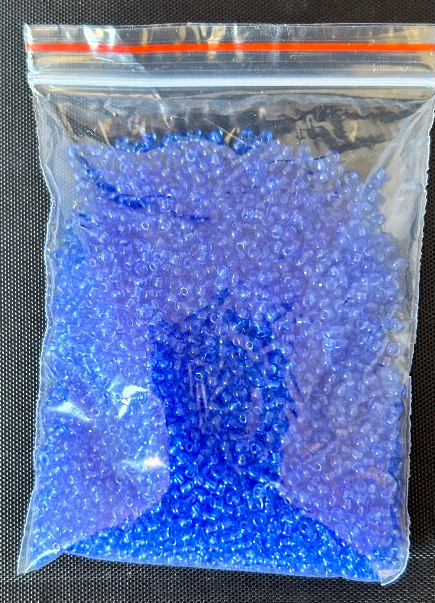 32 gram bag of blue transparent chez 11/0 seed beads approx 4080 seed beads
