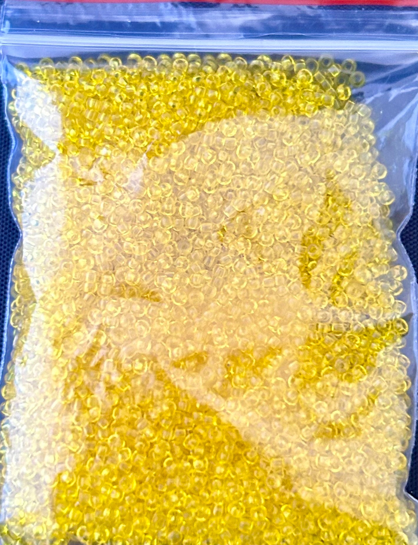 32 gram bag of yellow transparent chez 11/0 seed beads approx 4080 seed beads