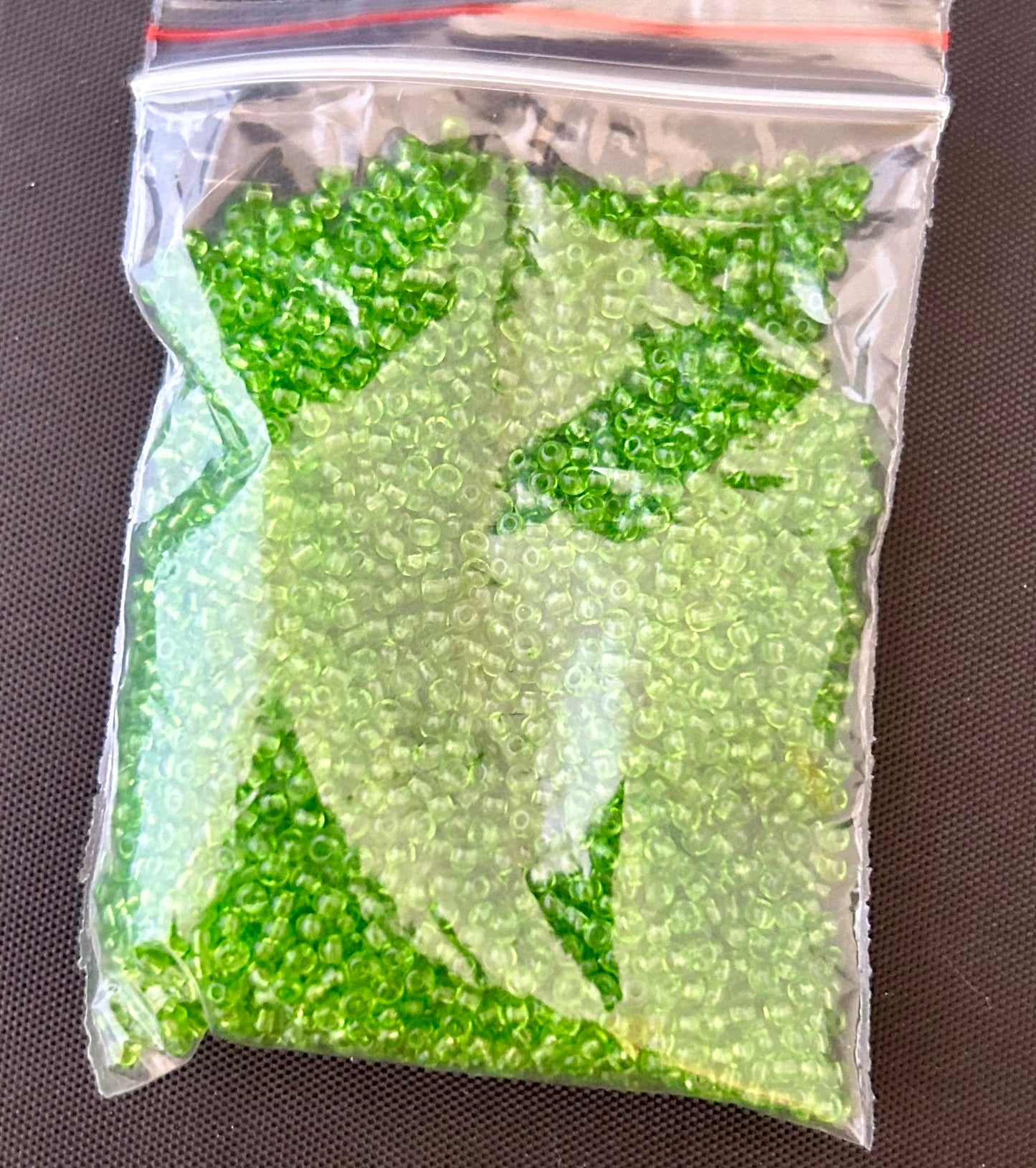 32 gram bag of lime green chez 11/0 seed beads approx 4080 seed beadse