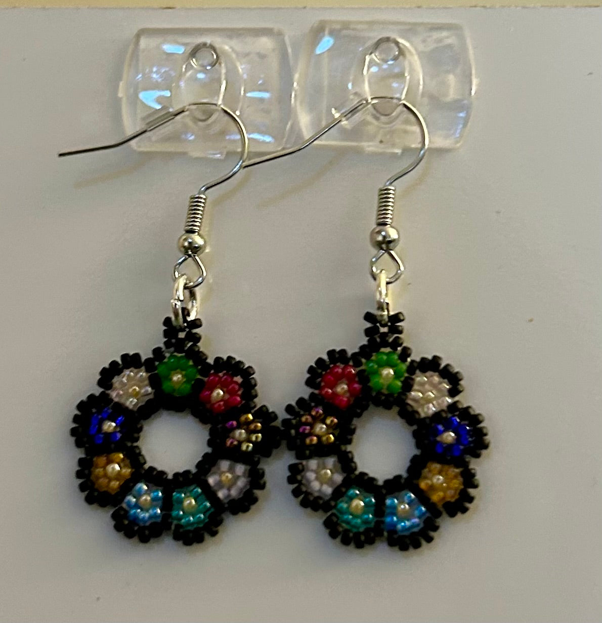 1" round flower earrings handmade with black and bright colored seed beads