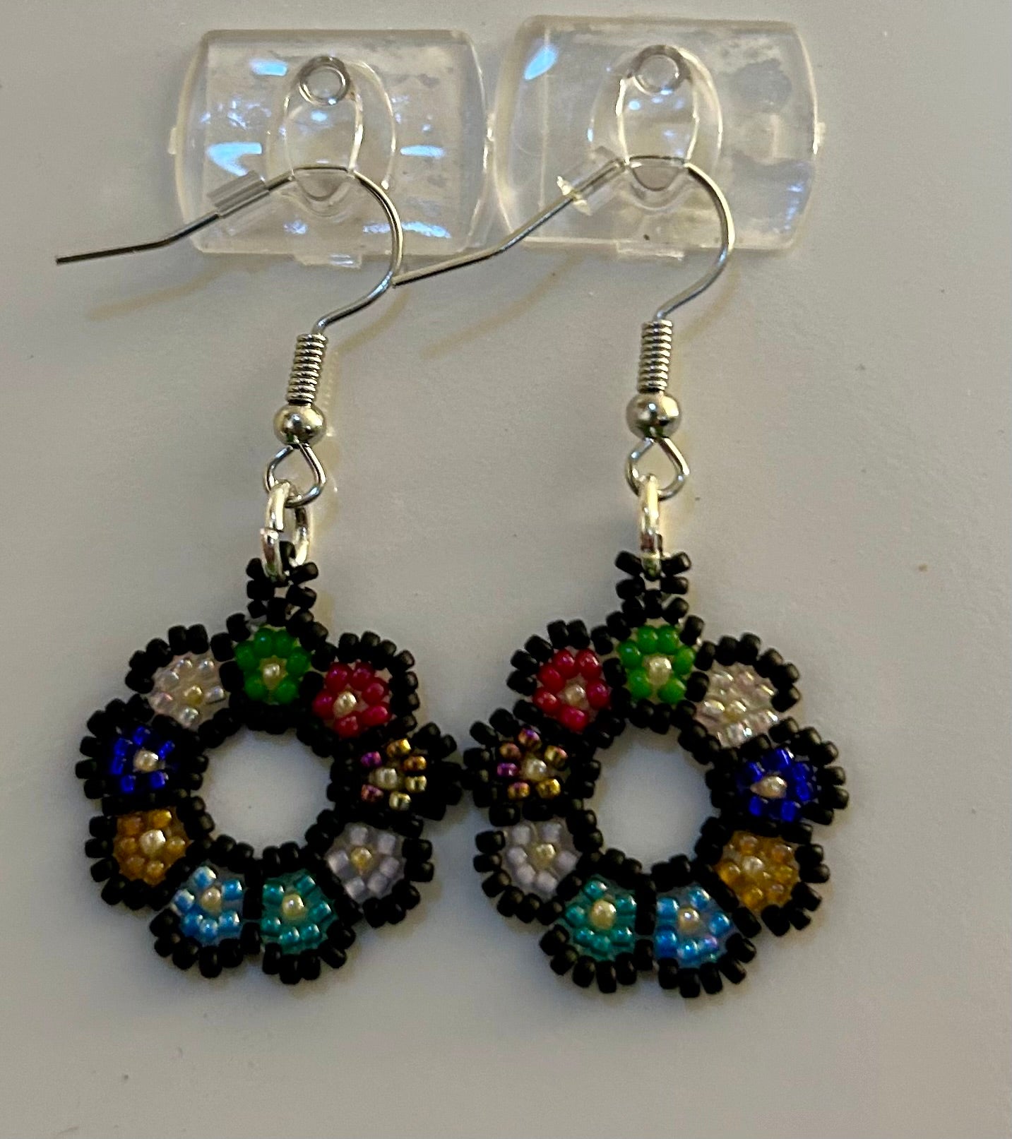 1" round flower earrings handmade with black and bright colored seed beads