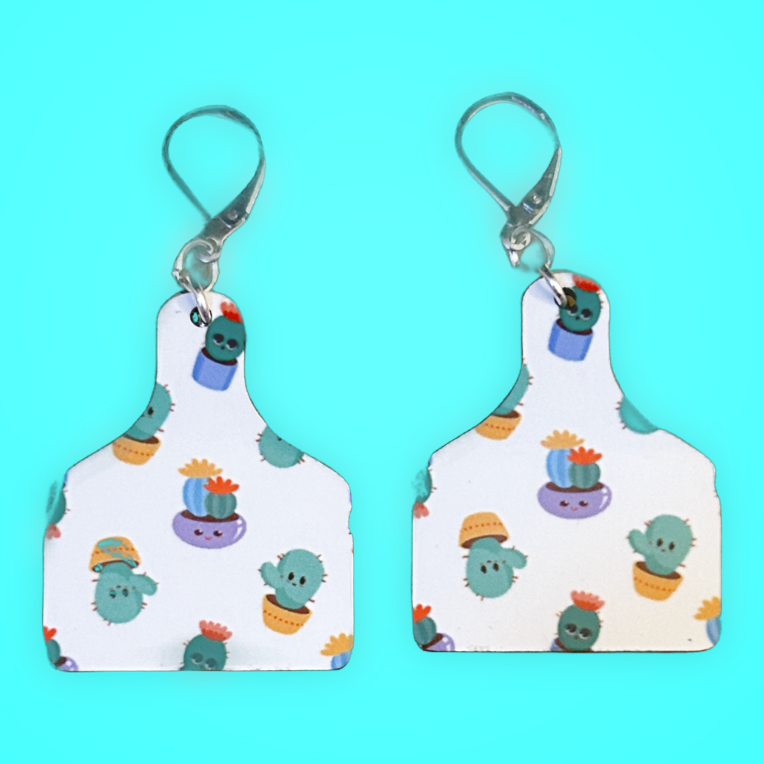 cutting board shaped earrings with cactus in pots with silver latch ear wires