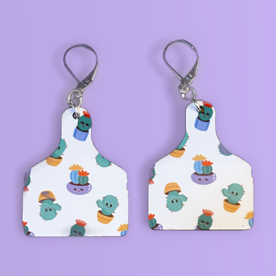cutting board shaped earrings with cactus in pots with silver latch ear wires