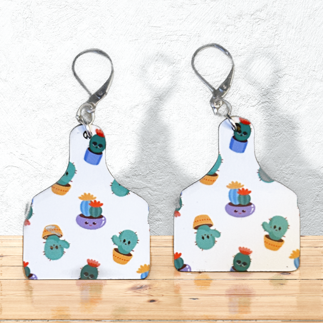 cutting board shaped earrings with cactus in pots with silver latch ear wires