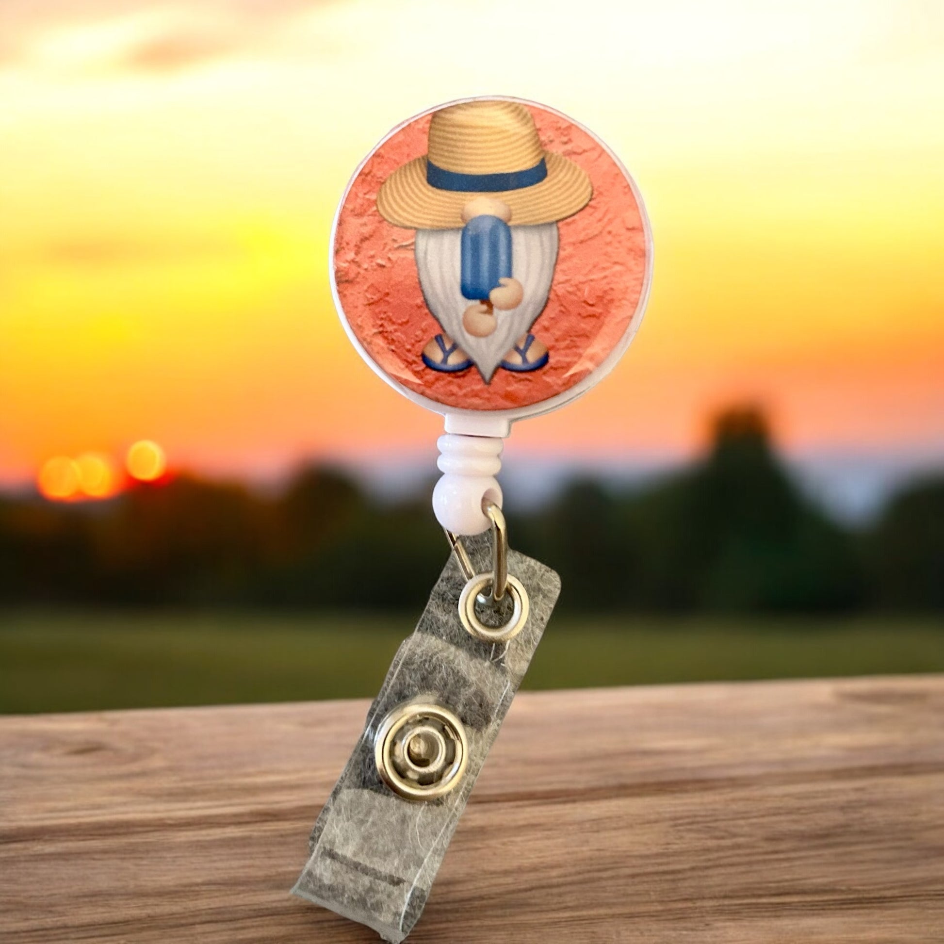 gnome with popsicle on  badge reel with badge holder