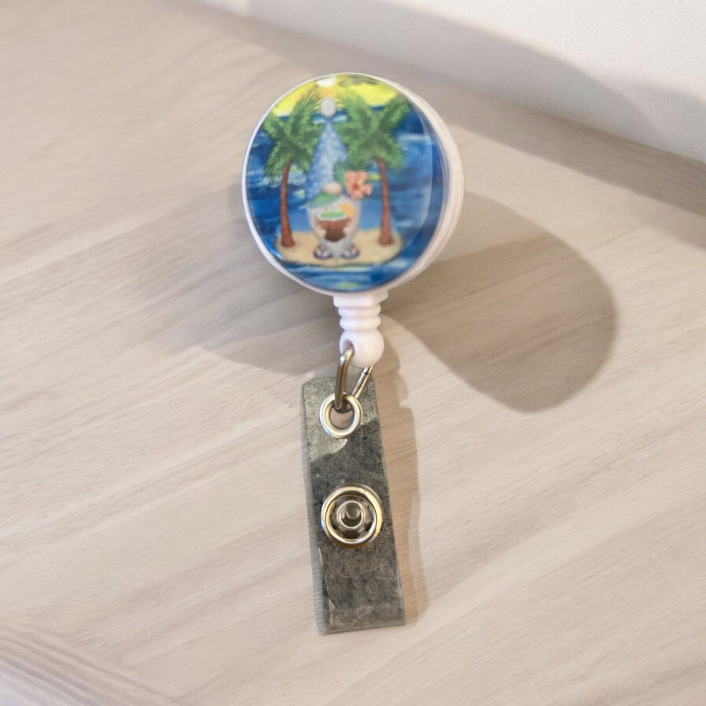 nome with coconut on island on badge reel with badge holder