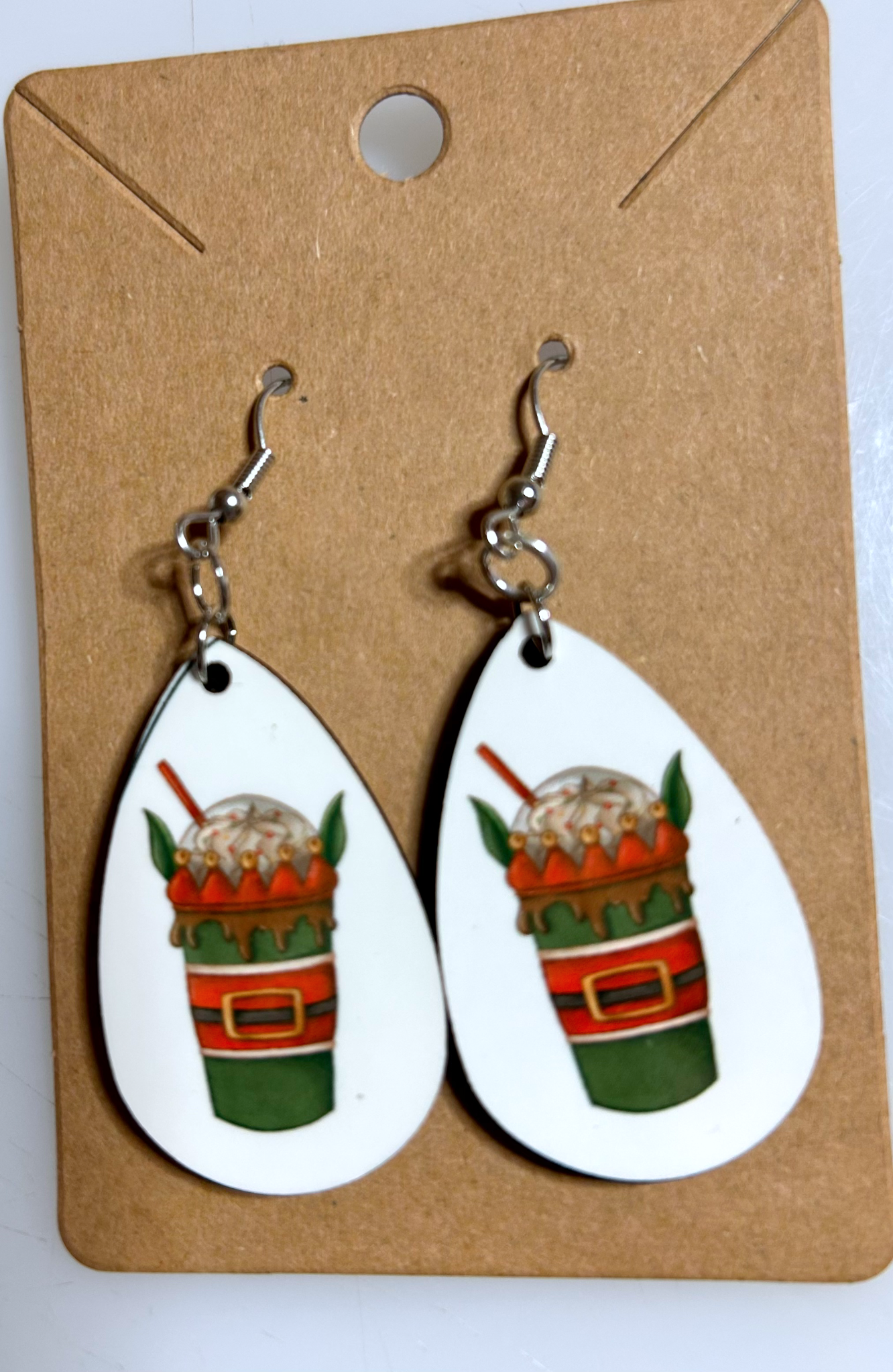 elf ear coffee drink teardrop earrings on kraft paper backing